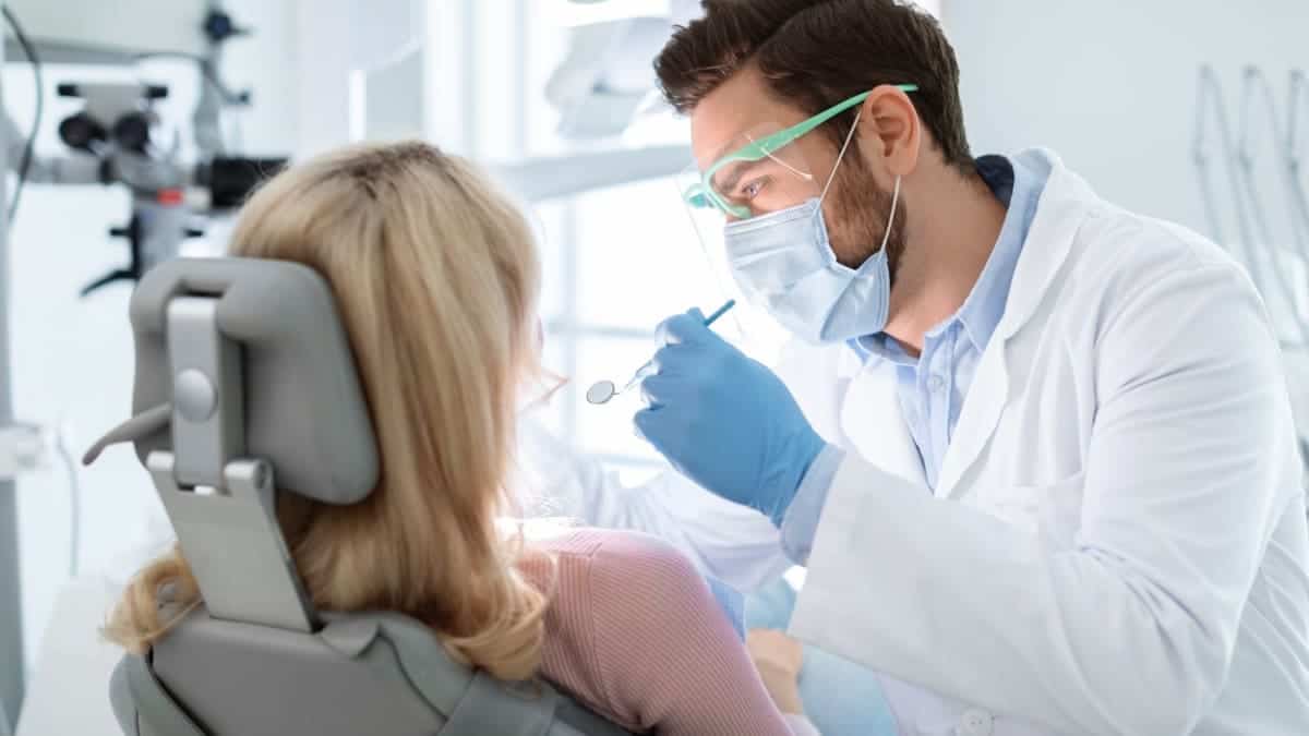Patient receiving professional teeth whitening with a laser device Middlesbrough